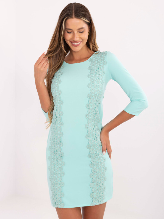 Abito cocktail menta con applicazione floreale