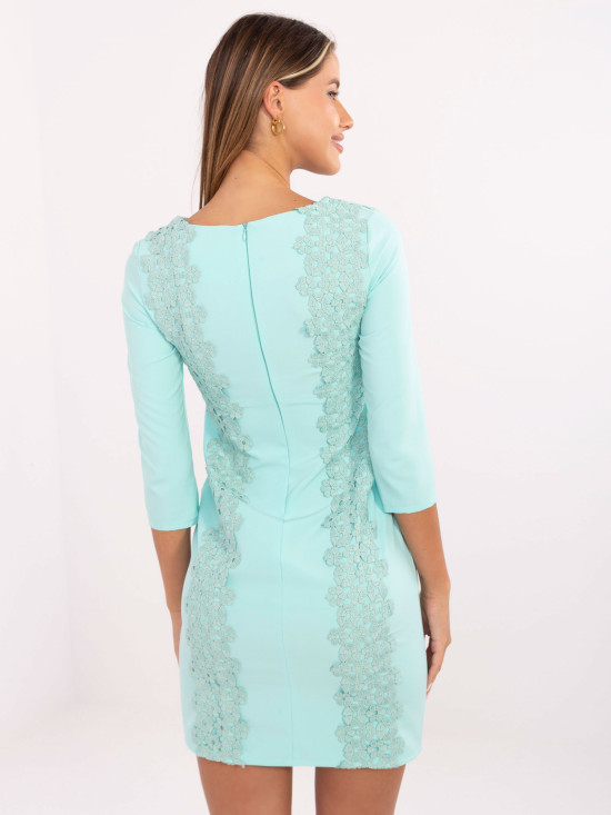 Abito cocktail menta con applicazione floreale