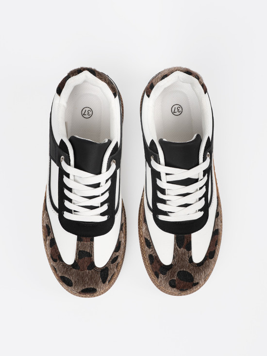 Sneakers bianco-neri con dettagli leopardati