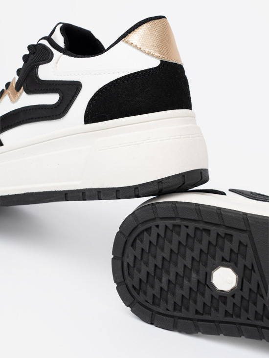 Sneakers nere e bianche con dettagli dorati
