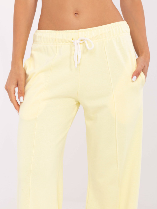 Pantaloni sportivi eleganti in giallo brillante