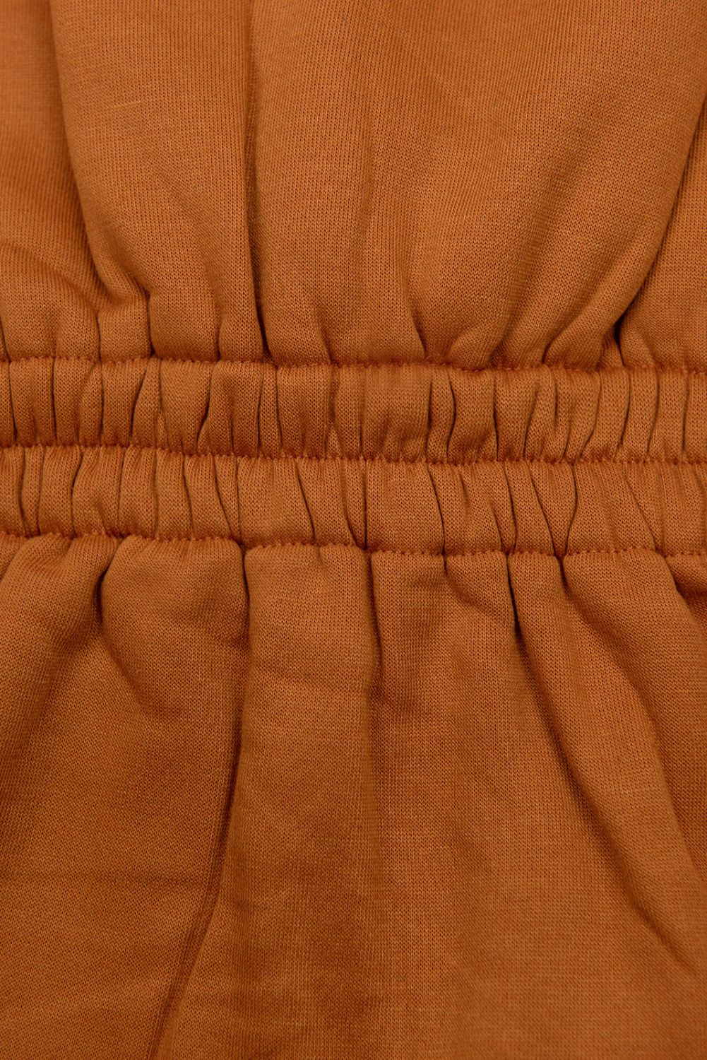 Felpa terracotta con vita modellata