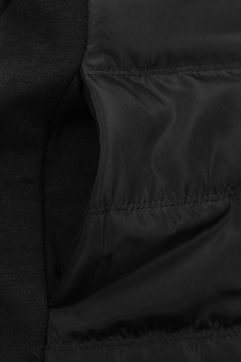Felpa nera in materiali combinati