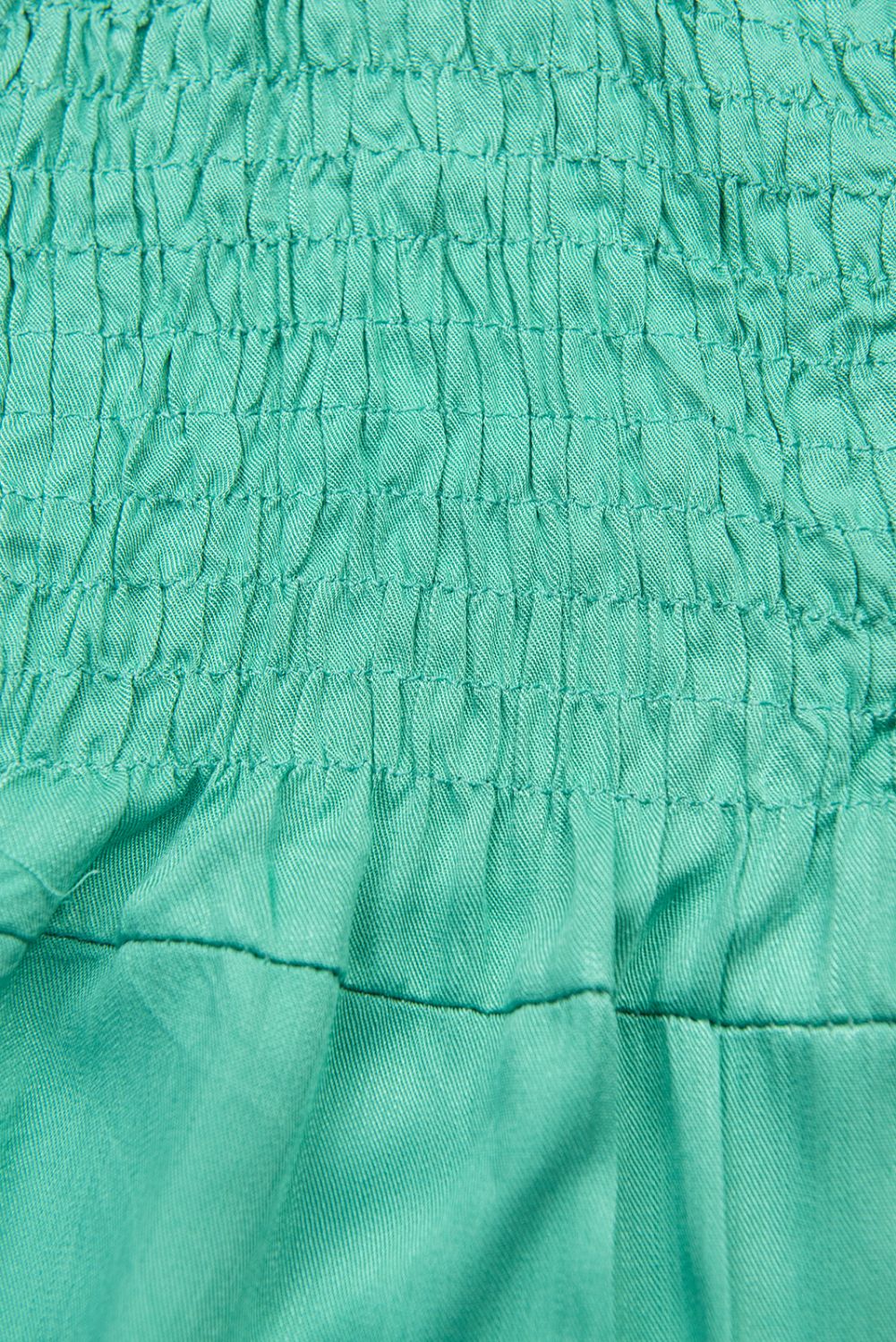 Tuta verde turchese
