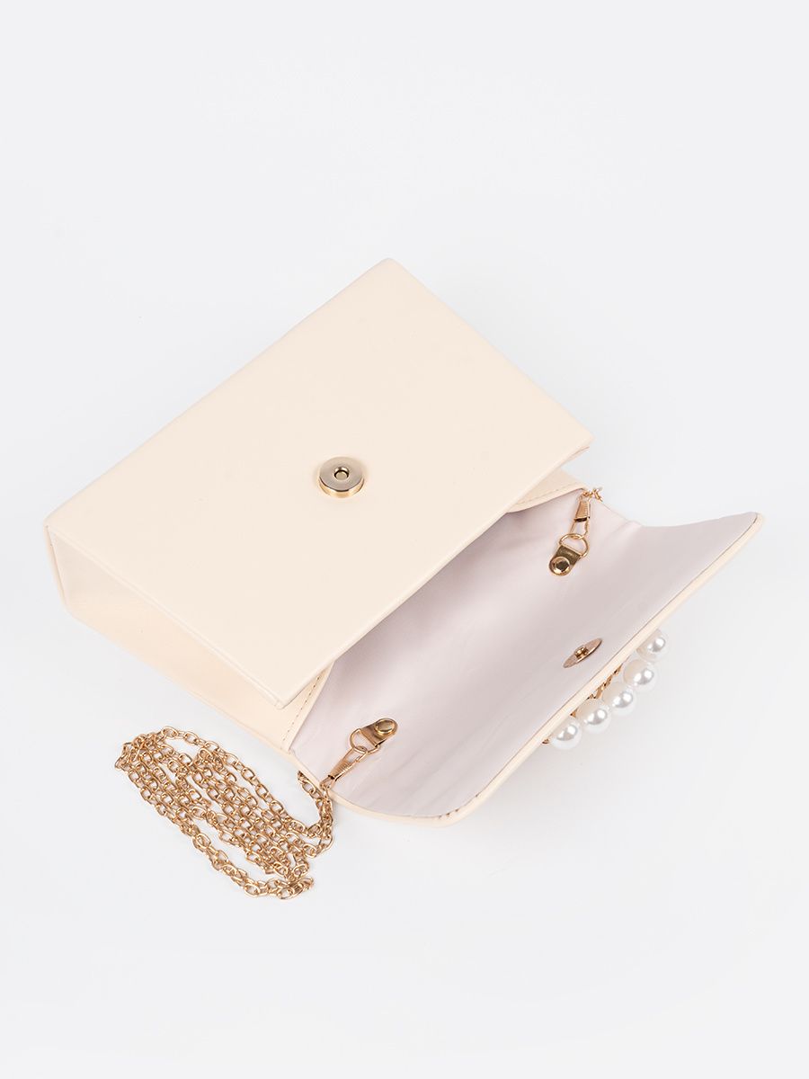 Elegante piccola borsa beige