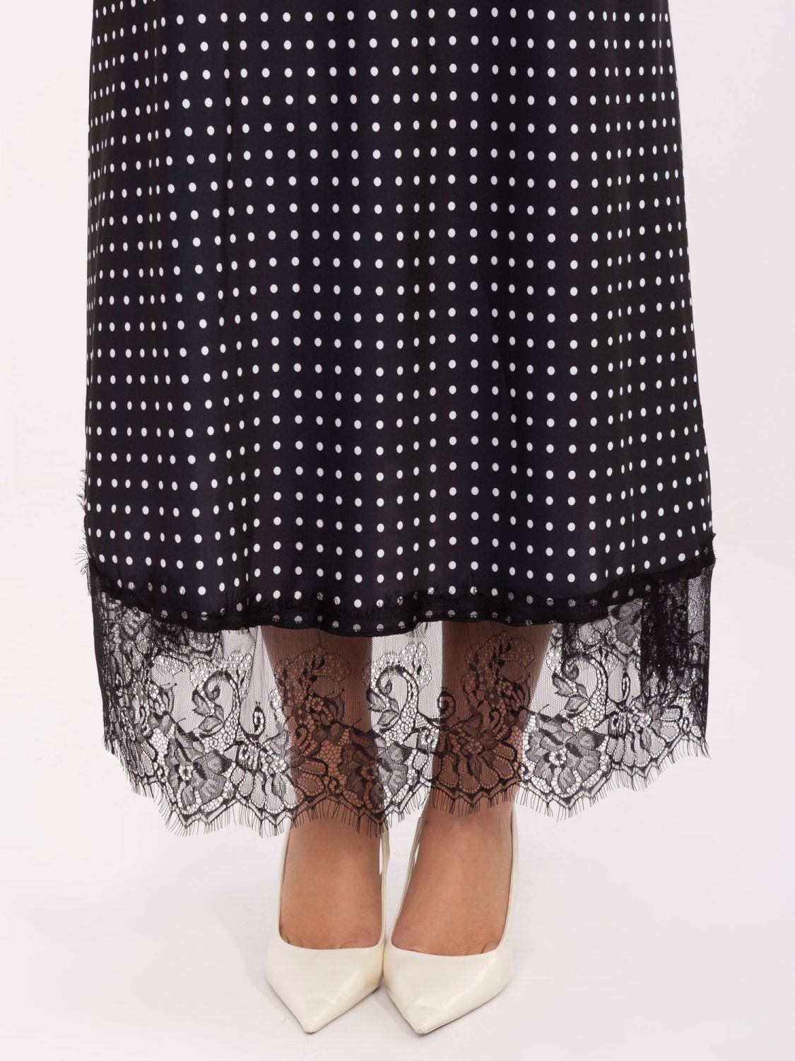 Gonna midi nera a pois con pizzo