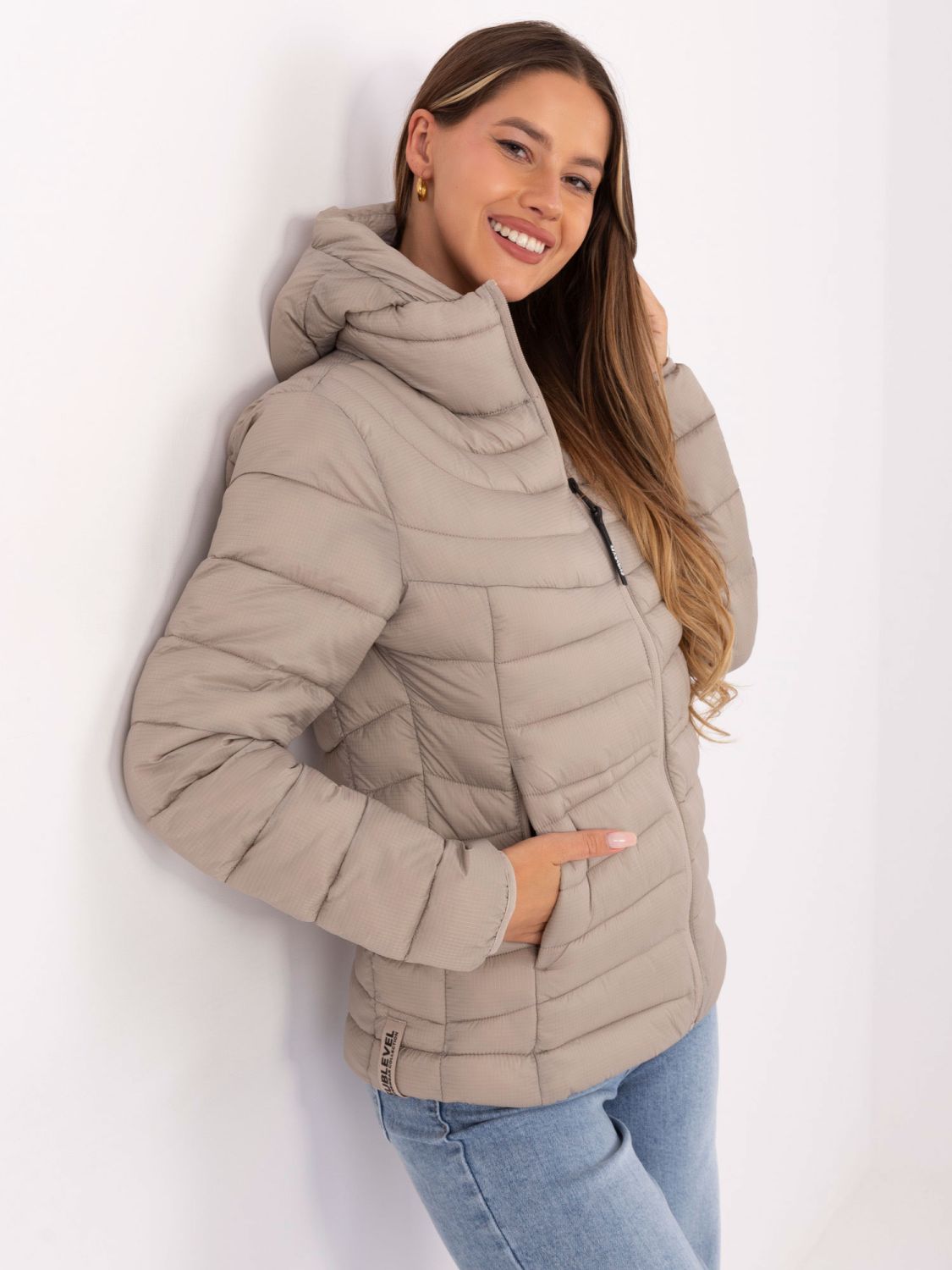 Giacca trapuntata beige con cappuccio