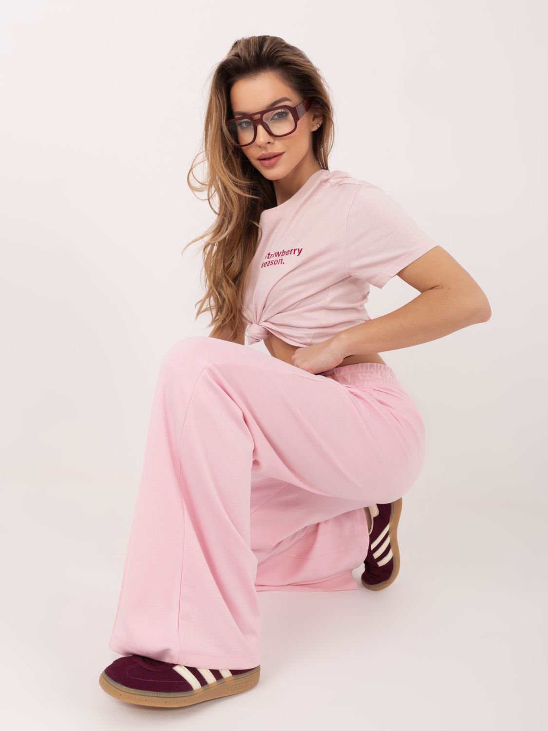 Pantaloni tuta rosa a gamba larga
