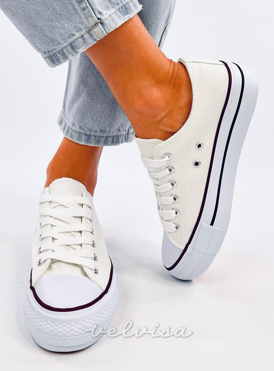 Sneakers basse in tela bianche