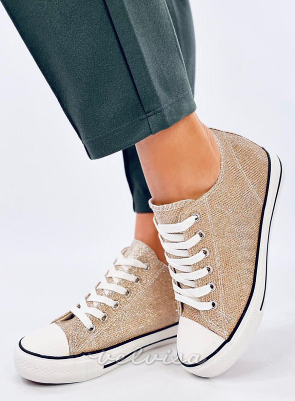 Sneakers dorate con tacco nascosto