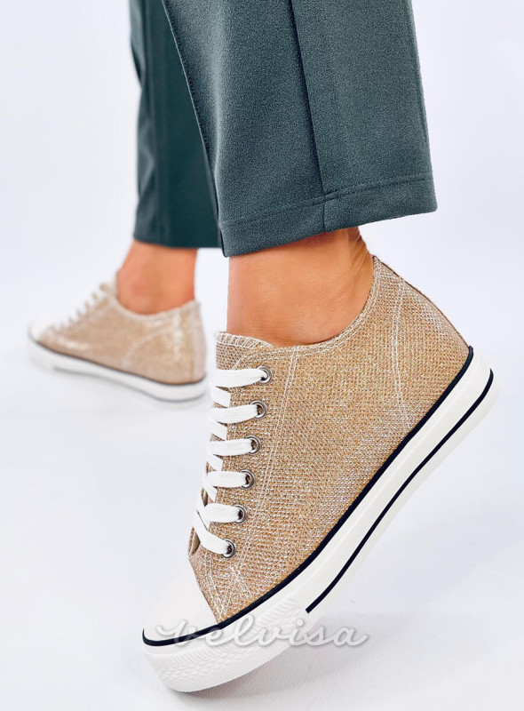 Sneakers dorate con tacco nascosto