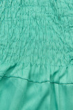 Tuta verde turchese