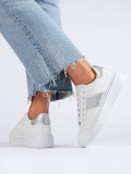 Sneakers bianche con striscia argentata
