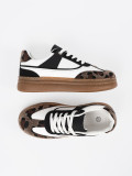 Sneakers bianco-neri con dettagli leopardati