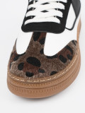 Sneakers bianco-neri con dettagli leopardati