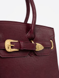 Borsa bordeaux con fibbia decorativa dorata