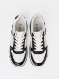 Sneakers nere e bianche con dettagli argentati lucidi