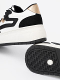 Sneakers nere e bianche con dettagli dorati