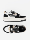 Sneakers nere e bianche con dettagli dorati