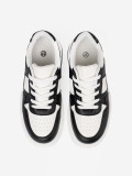 Sneakers neri e bianchi alla moda con suola spessa