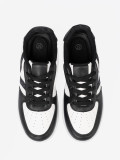 Sneakers stilosi bianchi e neri con dettagli brillanti