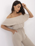 Tuta beige con volant