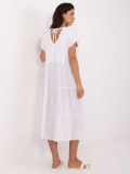 Abito bianco oversize con volant