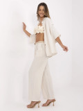 Pantaloni beige larghi con cintura