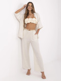 Pantaloni beige larghi con cintura