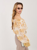 Blusa gialla con fantasia floreale e spalle scoperte
