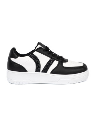 Sneakers stilosi bianchi e neri con dettagli brillanti