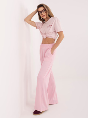Pantaloni tuta rosa a gamba larga